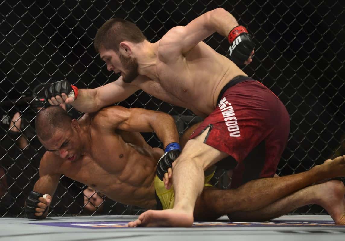 Khabib Nurmagomedov controls Edson Barboza on the mat at UFC 219