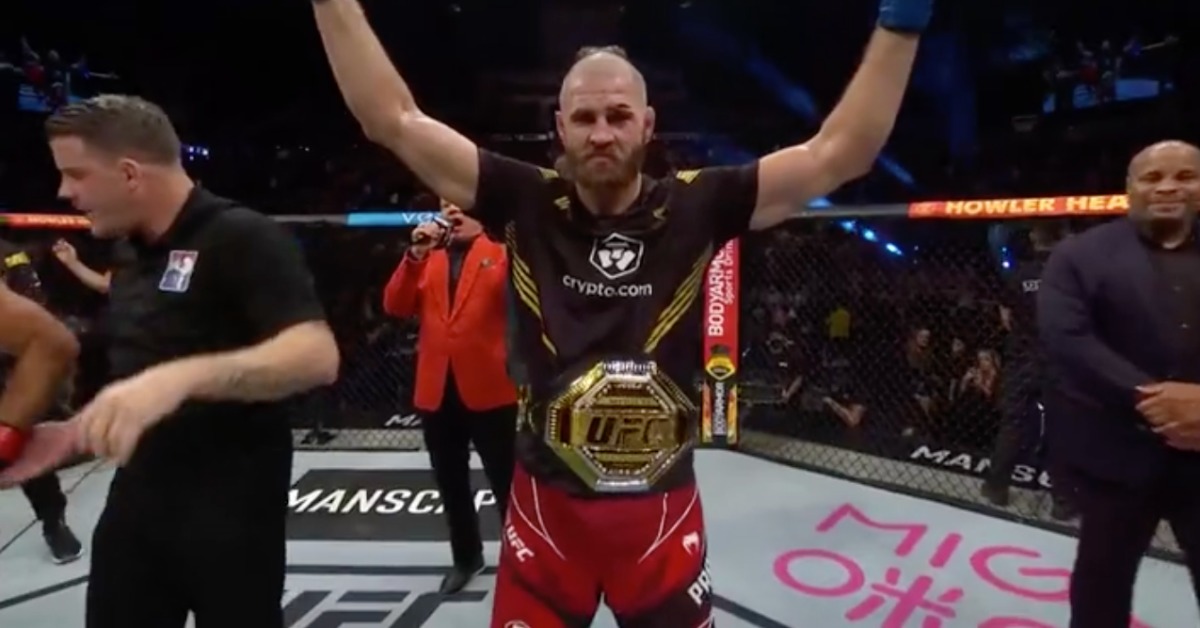 Jiri Prochazka celebrates with the UFC light heavyweight title after submitting Glover Teixeira at UFC 275