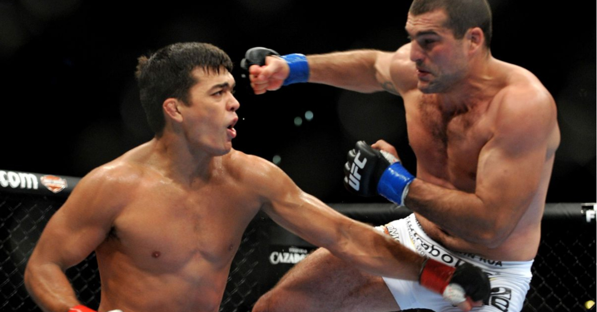 Lyoto Machida punches Mauricio "Shogun" Rua inside the Octagon