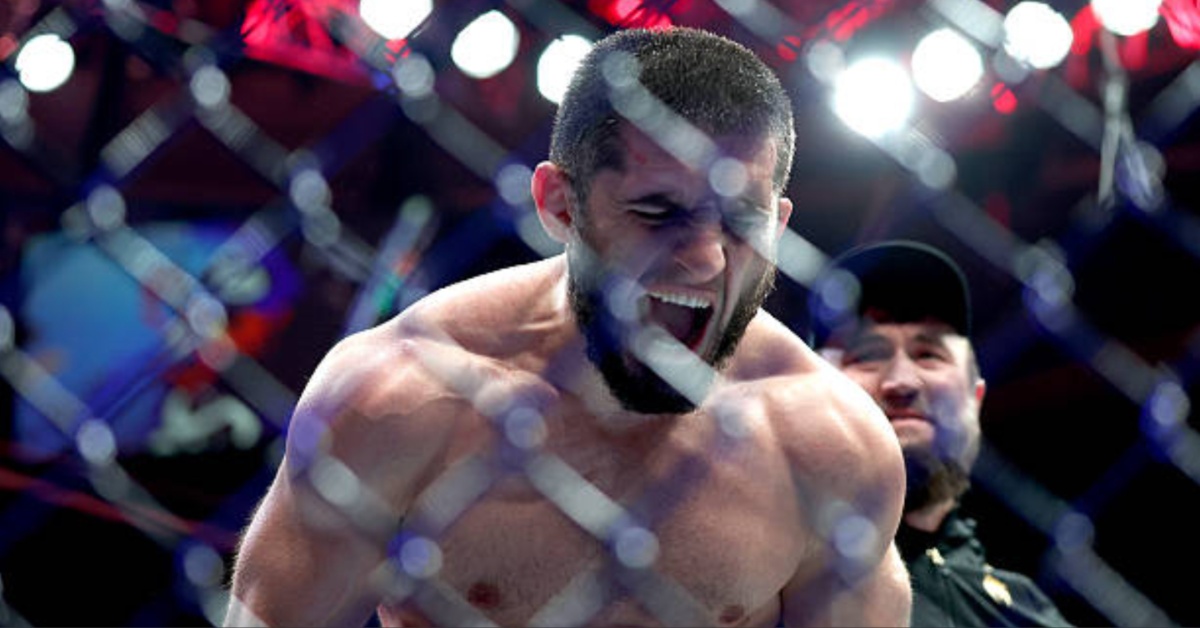 Islam Makhachev roars against the cage after winning the UFC welterweight title at UFC 322