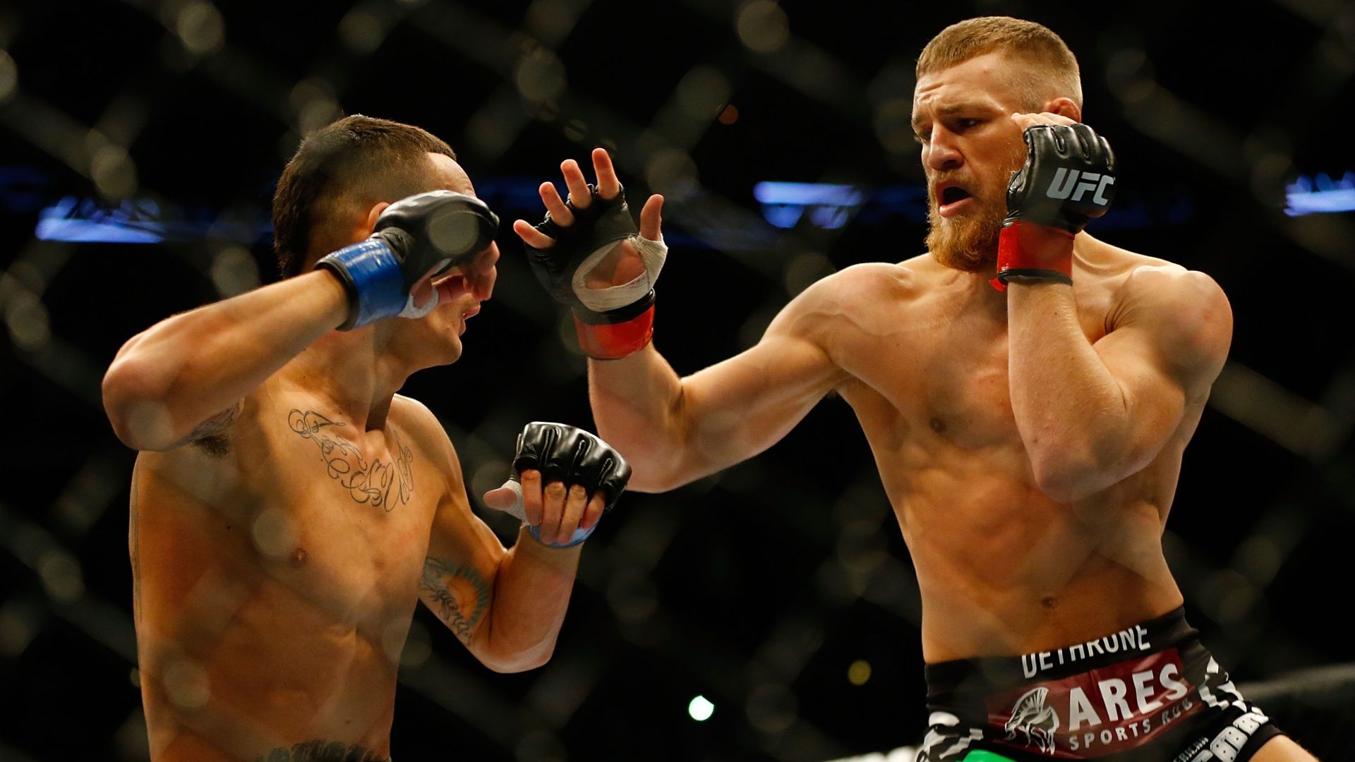Conor McGregor and Max Holloway in their 2013 fight