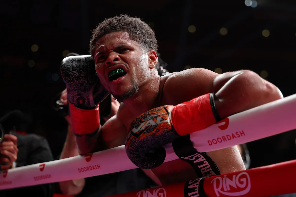 Shakur Stevenson leans on the ring ropes shouting in celebration after a win