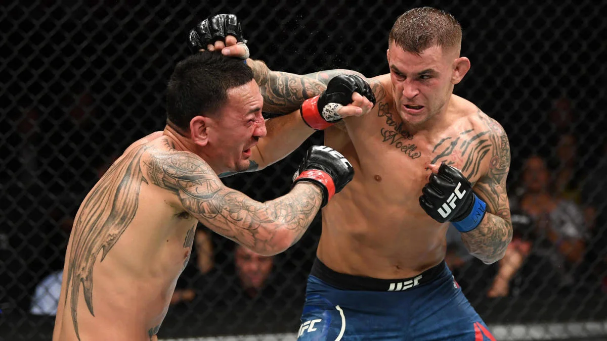 Dustin Poirier lands a punch on Max Holloway during their UFC 236 interim title fight