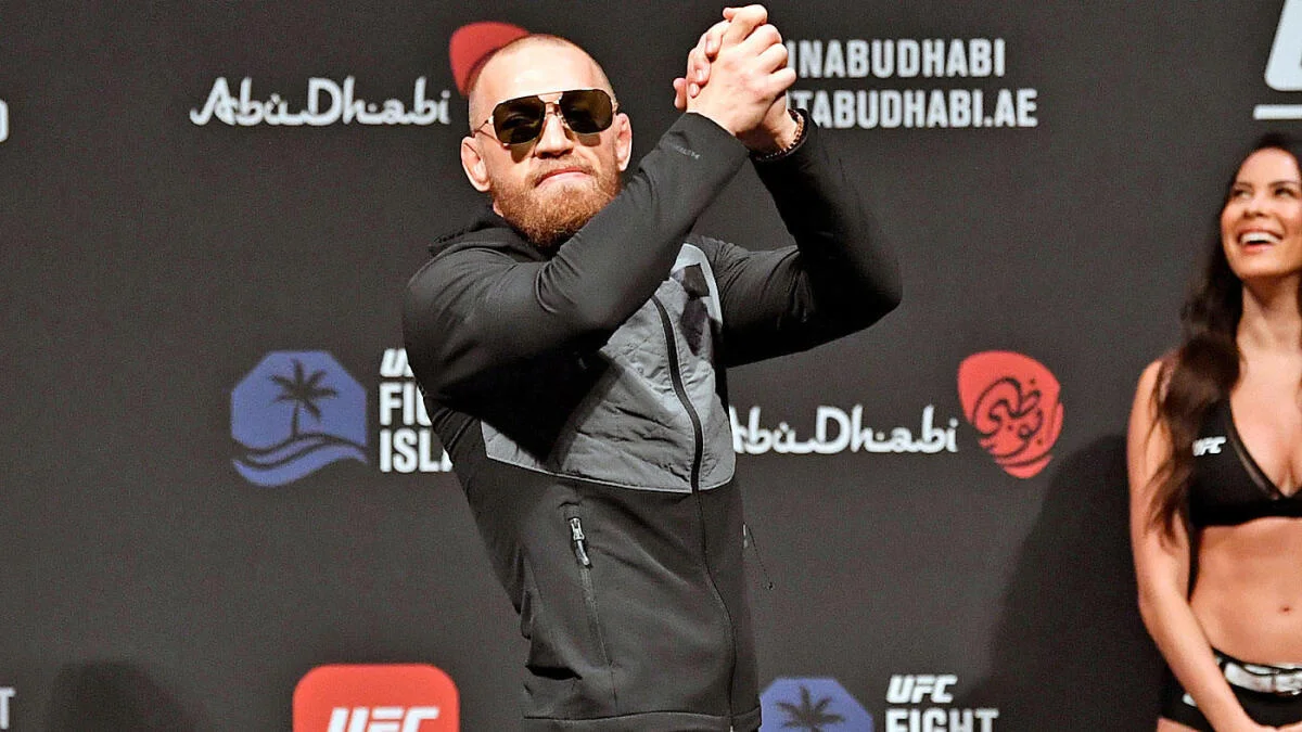 Conor McGregor in a suit at a press event