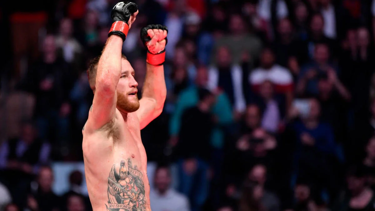 Justin Gaethje raises his arms after his win over Michael Chandler at UFC 268