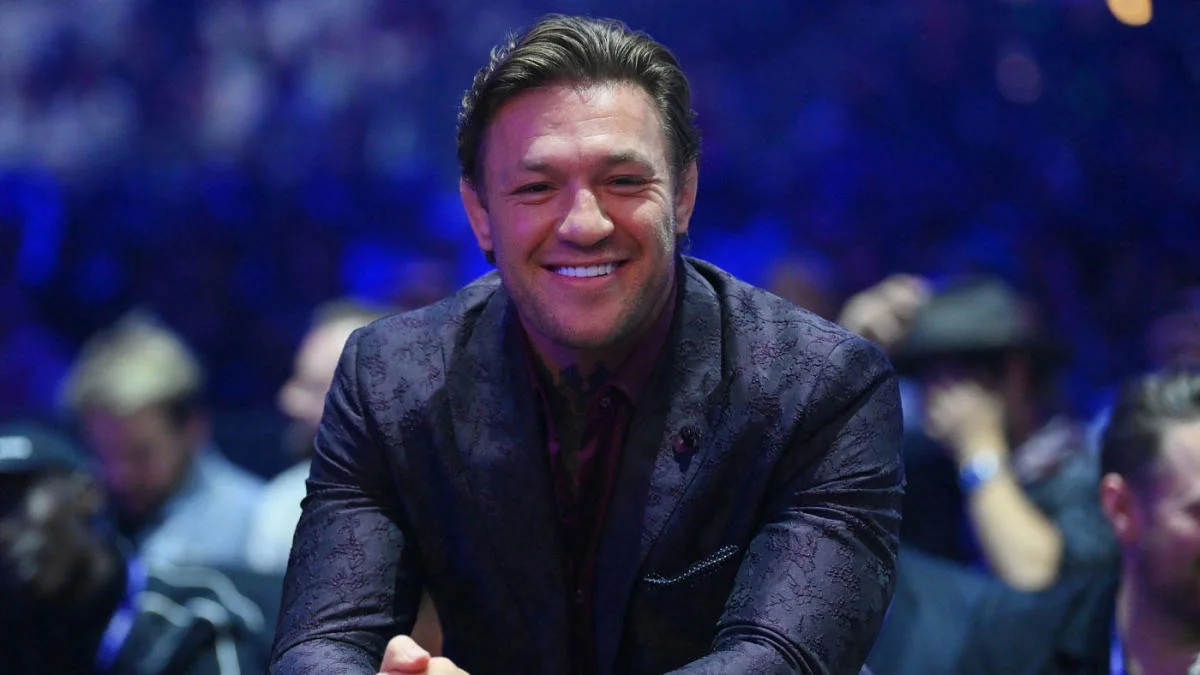 Conor McGregor smiling at a UFC press conference
