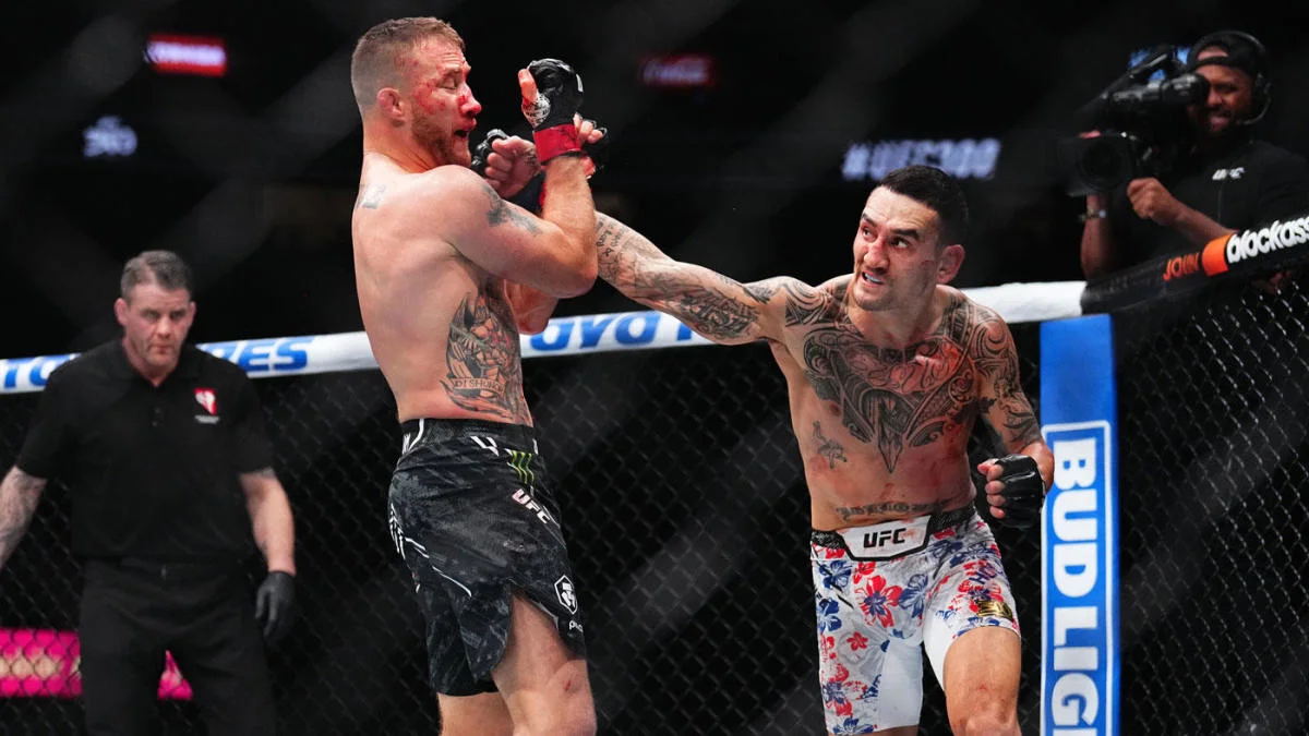 Max Holloway lands a punch on a bloodied Justin Gaethje during their BMF title fight at UFC 300