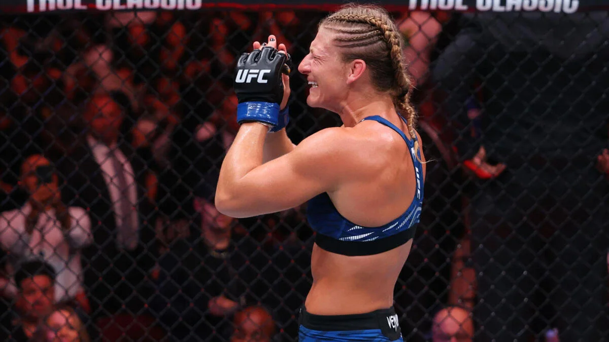 Kayla Harrison celebrates winning the UFC bantamweight title at UFC 316