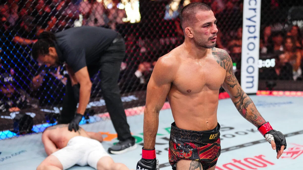 Alexandre Pantoja celebrates retaining the UFC flyweight title at UFC 317