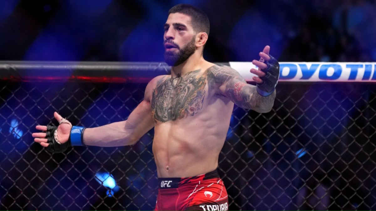 Ilia Topuria celebrates in the Octagon after knocking out Alexander Volkanovski at UFC 298