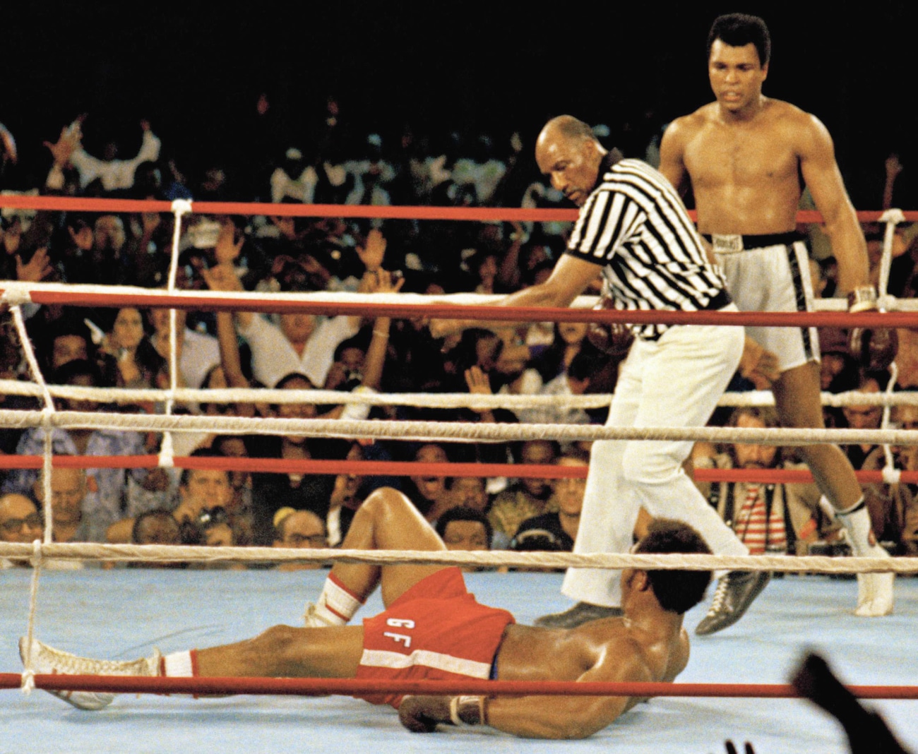 Muhammad Ali stands over George Foreman in Kinshasa